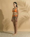 Load image into Gallery viewer, Palm Mirage Plunge Bikini Top in Spanish Orange
